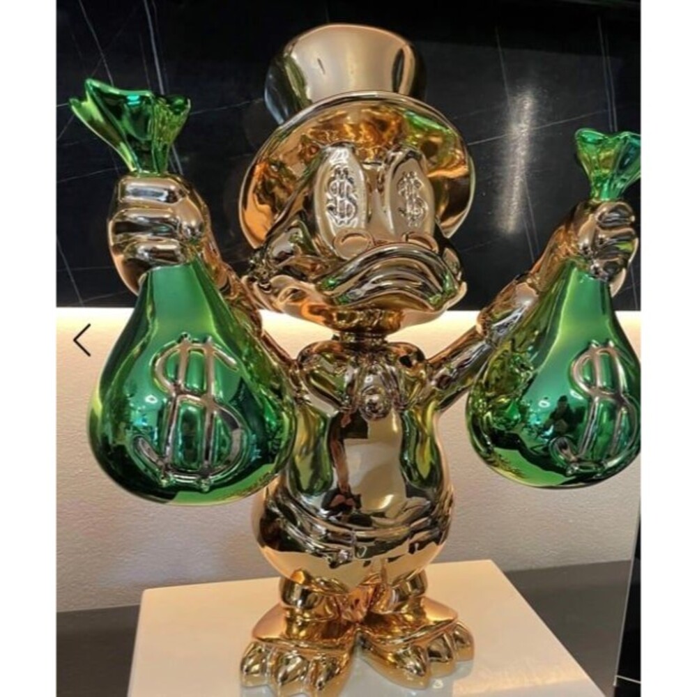 Scrooge mcduck gold chrome money bag duck sculpture